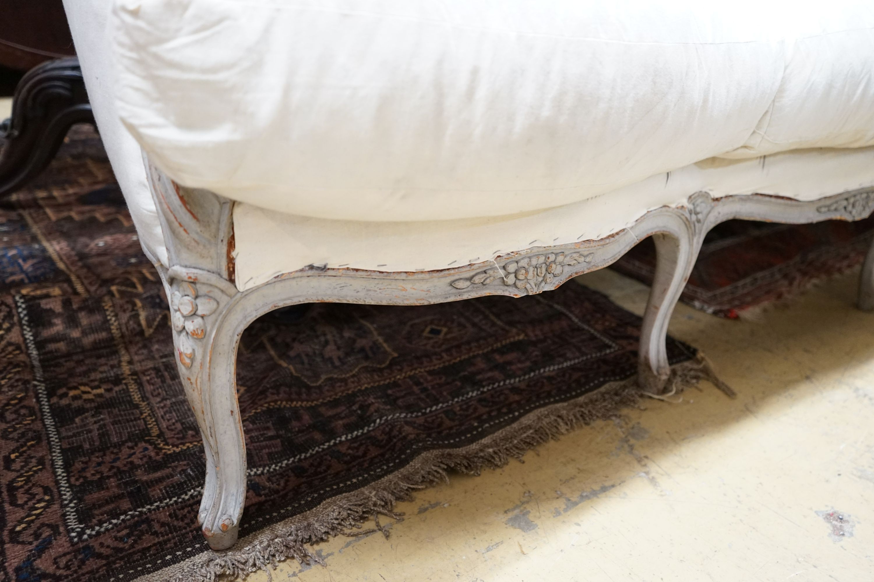 A 19th century French painted carved beech settee, length 182cm, depth 76cm, height 88cm